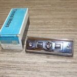 NOS GM 20411764 Escutcheon Driver Seat Cushion Side Panel Reclining Chevrolet