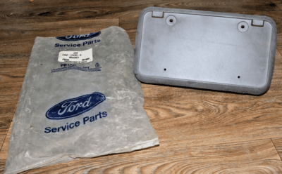 s-l400 1998 - 2011 Ford Crown Victoria Front Bumper License Plate Mounting Bracket NOS - Image 2