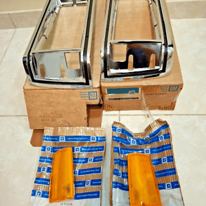 NOS OEM Chevrolet Caprice Head Light Chrome Bezel W/ Lens  81-85  Left and Right