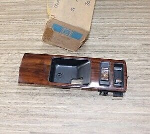 NOS GM 10242034 bezel front side door inside handle (woodgrain) Chevrolet 91-96