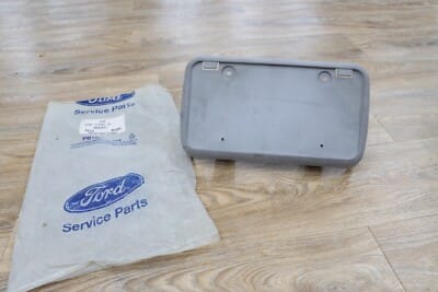 1998 - 2011 Ford Crown Victoria Front Bumper License Plate Mounting Bracket NOS 1998 - 2011 Ford Crown Victoria Front Bumper License Plate Mounting Bracket NOS