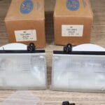 NOS Ford LH-RH headlight clusters with bulbs F23Z13008B - F23Z13008A 1992-1997