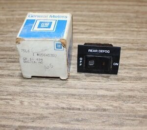 NOS GM 14040843 1985 1991 CHEVROLET SUBURBAN REAR DEFOG DEFROST SWITCH BEZEL