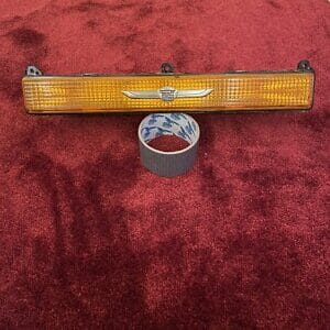 NOS Cadillac Brougham RH FRONT SIGNAL LAMP marker light Gold Emblem