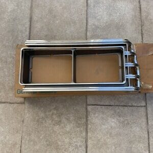 NOS GM 1979 Pontiac Catalina Left Head Light Door Trim Bezel 10003619